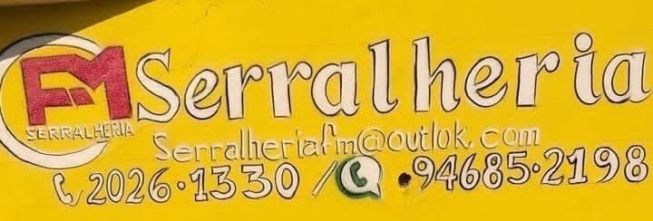 Muro da oficina com o letreiro pintado da serralheria